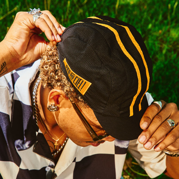 Black and yellow cycling cap